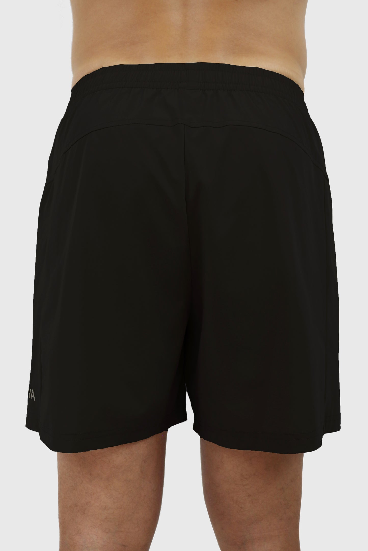 Black men's shorts with elastic waistband worn by a person on a white background
