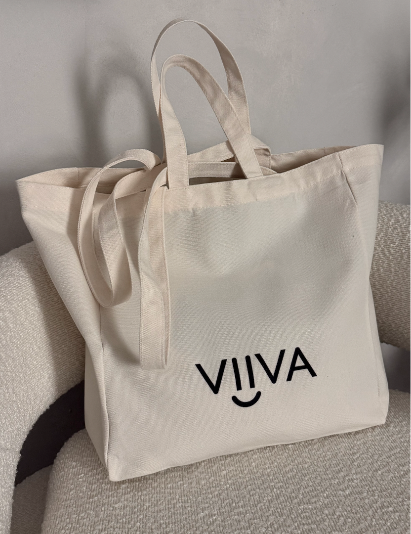 Canvas tote bag with double handle and 'VIIVA' logo on a neutral background